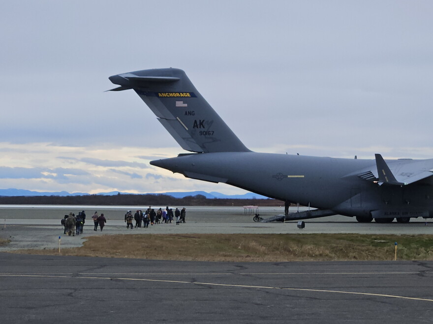 People displaced by ex-Typhoon Halong board a C-17 military transport plane in Bethel to be evacuated to Anchorage on Oct. 15, 2026.