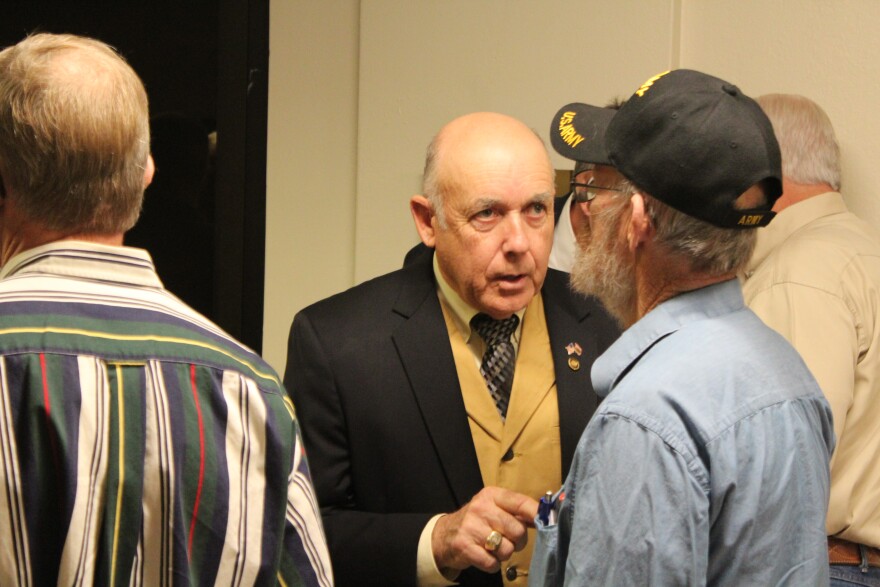 Republican State Rep. Warren Love speaks with members of the audience of a House Ethics Committee hearing on Jan. 4, 2018.