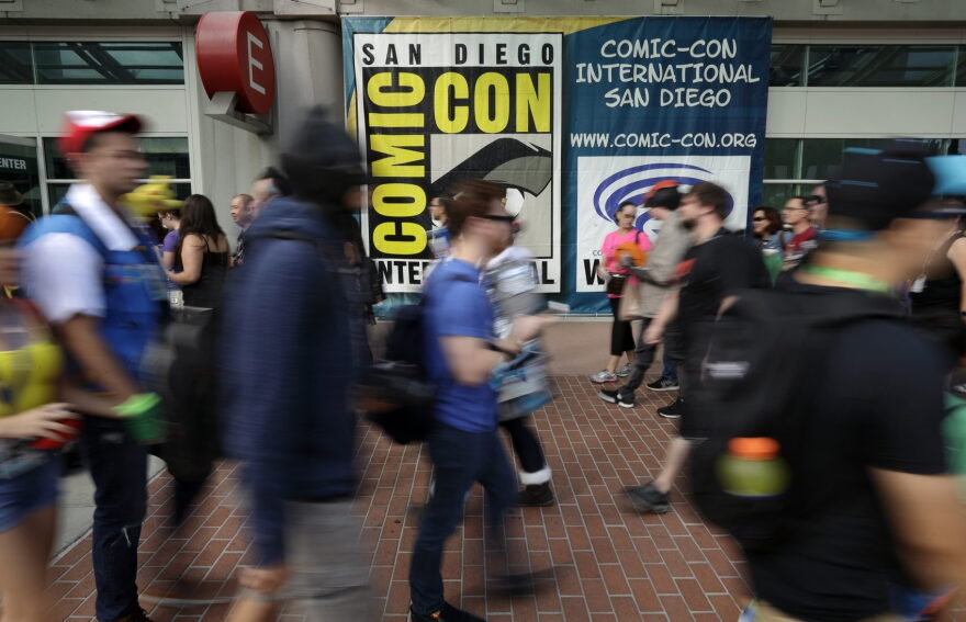 People arrive for the first day of Comic-Con Thursday, July 20, 2017, in San Diego. Comic-Con, which started as a comic-book convention with 300 participants in 1970 and has grown into a corporate-heavy media showcase that draws more than 130,000 attendees, runs through Sunday in San Diego. (Gregory Bull/AP)