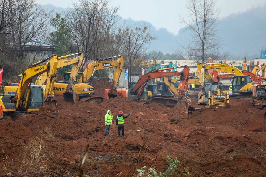 Two new health care facilities are going up. Huoshenshan Hospital (above), scheduled to open on Feb. 3, is named for a god of fire, reportedly because the newly identified coronavirus does not tolerate high heat. The second facility will be called Leishenshan, which means "lightning god mountain." In Chinese folklore, the lightning god punishes those who commit unethical acts.