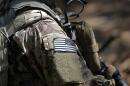 A U.S. flag patch adorns the uniform of a paratrooper, April 21, 2017, during a training exercise at Fort Bragg, N.C. (Gerry Broome/AP)