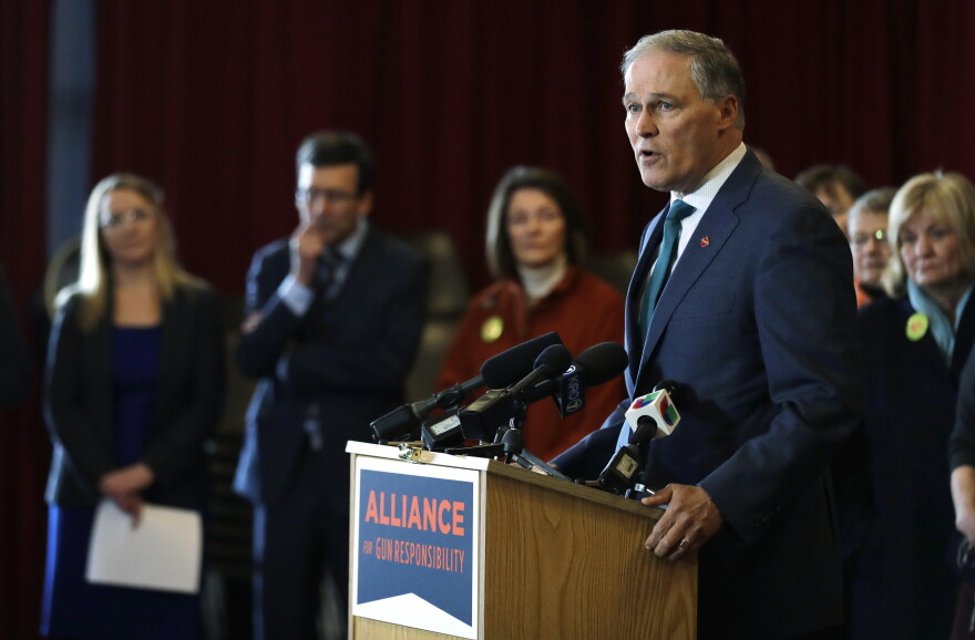 Washington Gov. Jay Inslee speaks Thursday, Feb. 14, 2019, in Seattle at an event held by the Alliance for Gun Responsibility. Inslee is expected to announce his bid for president as soon as this week.