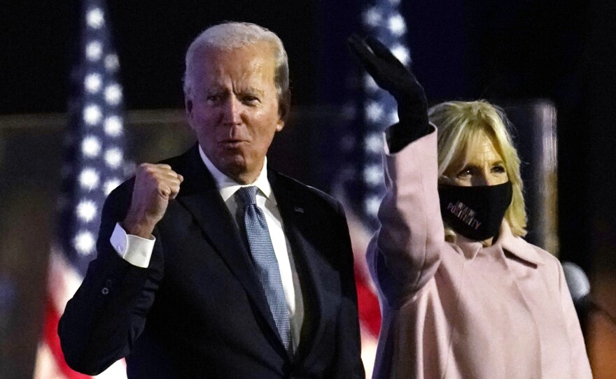 Biden speaks to supporters early Wednesday in Wilmington, Del., with his wife, Jill Biden.