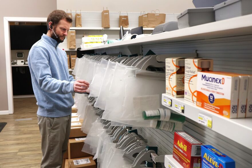 A pharmacist at Mayo Pharmacy in Bismarck, N.D., reviews completed pharmaceutical orders in January 2026.