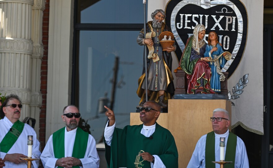 Rev. Michael Rowe leads the congregation during the Mass on Monday.