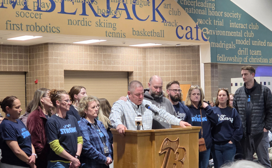 J.W. Smith Elementary Principal Bruce Goodwin addresses the Bemidji School Board, surrounded by J.W. staff, during a public hearing at Bemidji High School on March 24, 2026.