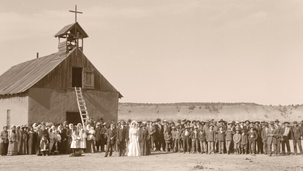 Ramon and Adela (Quintana) Gallegos wedding photograph. Taken in front of the first Santa Rosa Church, Rosa, NM, 1912.