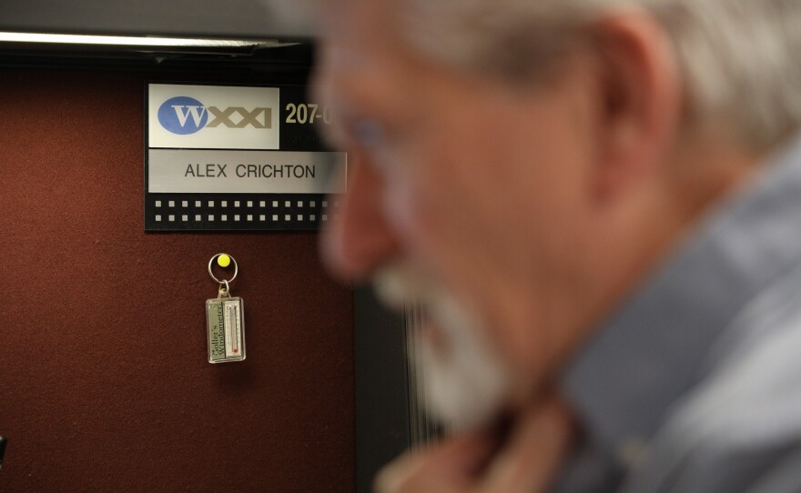 Alex Crichton sits at his desk in one of the newsrooms at WXXI as he prepares to locally host NPR’s “All Things Considered” on Monday, Feb. 9, 2026.