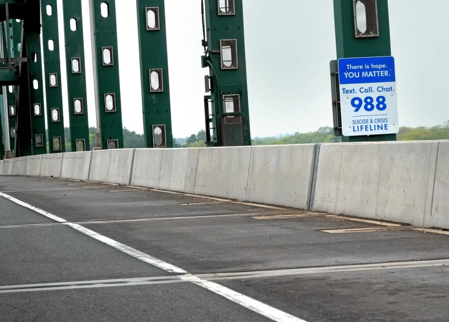 A sign on the Piscataqua River Bridge connecting Portsmouth, NH, to Kittery, Maine, reminds people that help is available for anyone experiencing a mental health crisis.