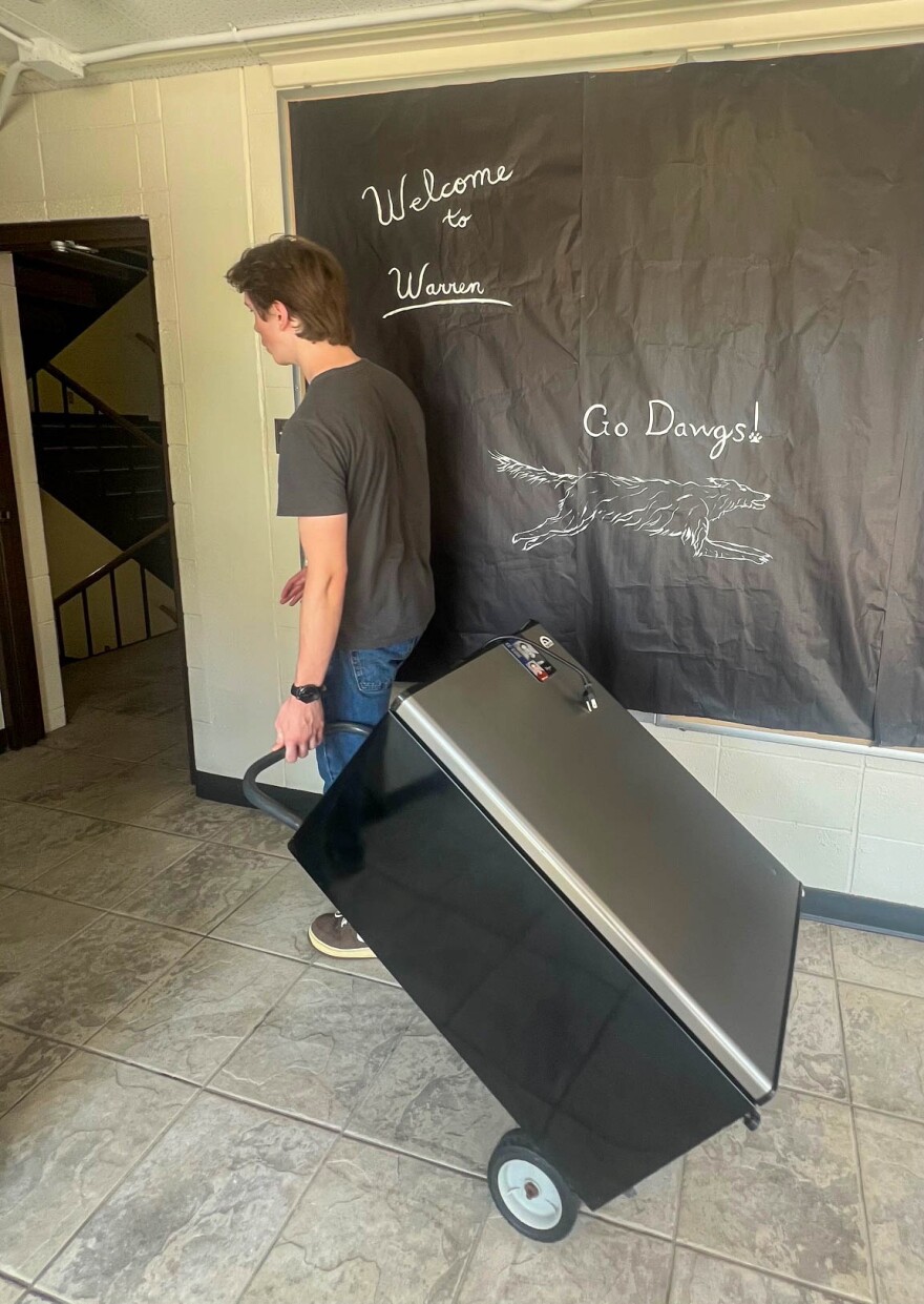 Keegan Greenwood, of Kirkwood, MO moves in a refrigerator to his new room at SIU.