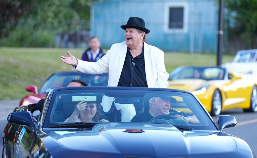Puyallup Tribe of Indians Chairman Bill Sterud rides in a car during the World Cup Parade that the tribe hosted. The tribe has hosted a number of events for people to join in on the World Cup fun.
