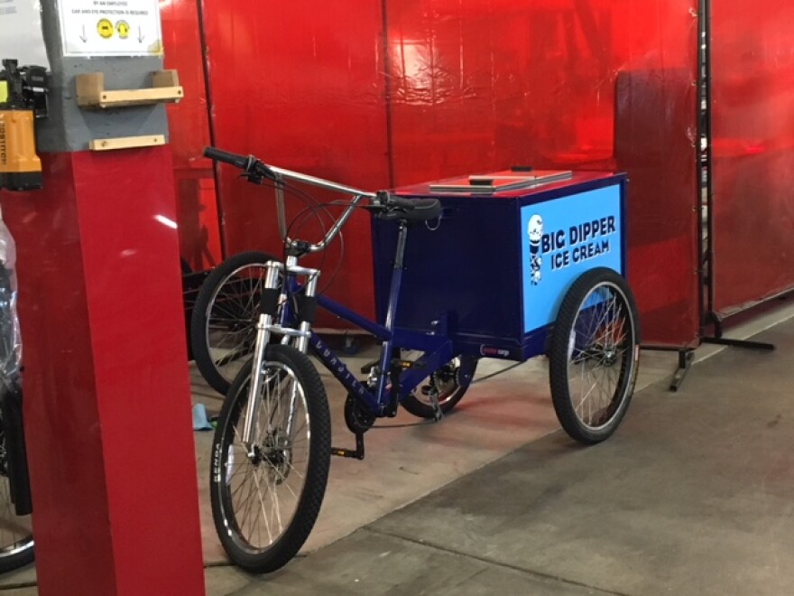 A pedicab custom made for Big Dipper ice cream. Coaster Pedicabs makes custom pedicabs at their factory in Bonner, MT.