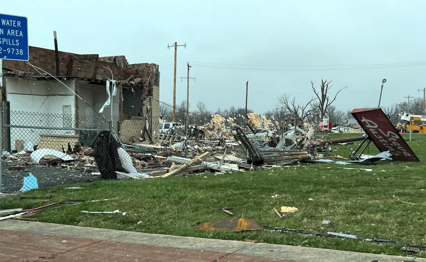 The sign for Steve Austin's auto shop was toppled by a tornado that swept through the Indian Lake area on March 14.