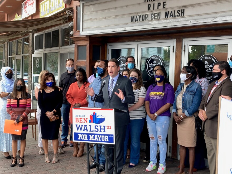 Supporters join Mayor Ben Walsh as he releases his "Keep Rising" plan for his second term in front of the Westcott Theater.