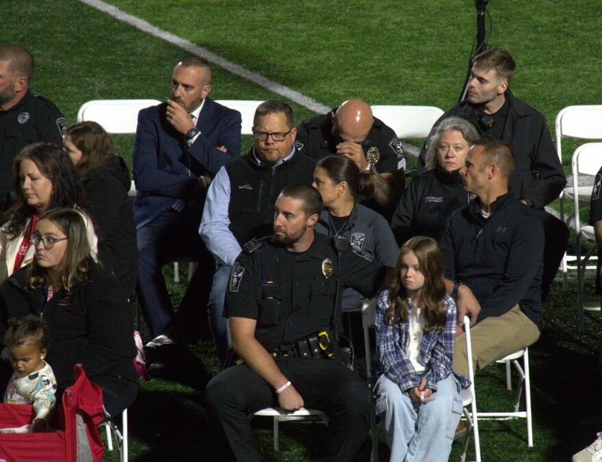 First responders look distraught as they listen to community officials speak about the tragedy that occurred on September 28.