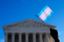 Protesters wave transgender pride flags outside the Supreme Court 