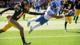 Kentucky wide receiver Dane Key, right, dives over the goal line for a touchdown in front of Missouri defensive back Kris Abrams-Draine, left, during the fourth quarter of an NCAA college football game Saturday, Nov. 5, 2022, in Columbia, Mo. (AP Photo/L.G. Patterson)