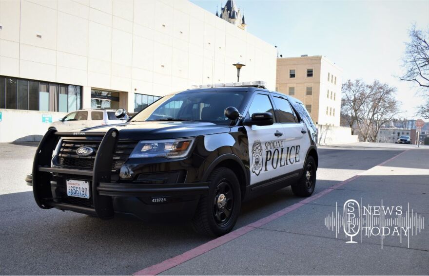 A Spokane Police vehicle sits parked at the county public safety campus. New data shows SPD has a much higher rate of clearing major crimes like homicide than other departments around the state.