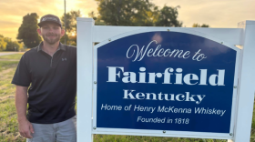 A recent photo of Herbie Hardin by the Fairfield, Kentucky sign.