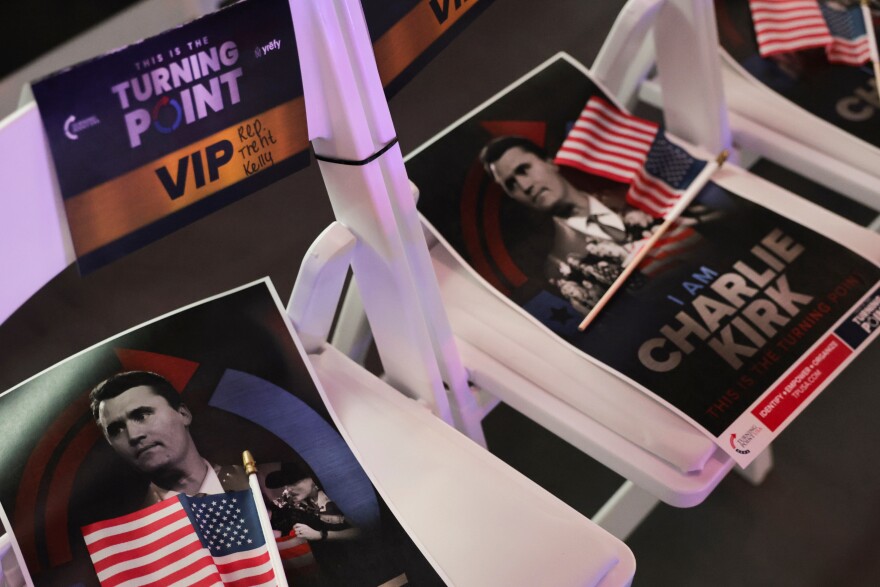 Signs with a photo of Charlie Kirk are seen at a Turning Point USA event at the Pavilion at Ole Miss at the University of Mississippi in Oxford, Miss., Wednesday, Oct. 29, 2025.