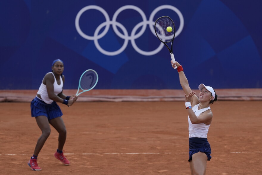 Coco Gauff and Jessica Pegula of the United States play Linda Noskova and Karolina Muchova of the Czech Republic during their women's doubles match, at the 2024 Summer Olympics, Wednesday, July 31, 2024, at the Roland Garros stadium in Paris, France. (AP Photo/Andy Wong)