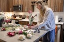 Woman arranges bouquets  
