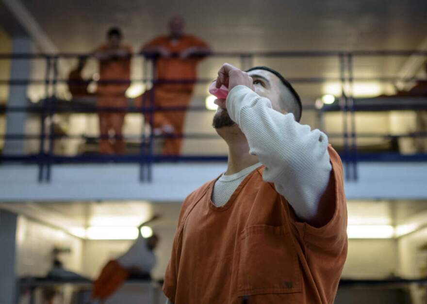 Inmates who are battling drug addiction take a dose of methadone. (Roberto E. Rosales for Here & Now)