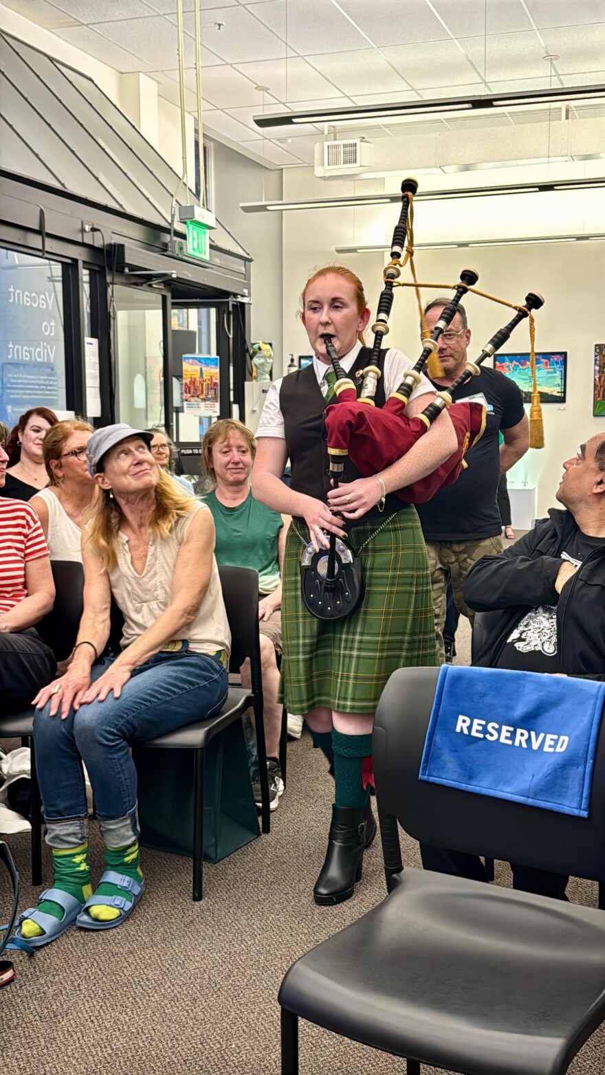 San Francisco Irish Pipers member Maggie Baglin opens the live event "The Bay Agenda: Keepers of the Steps" by playing the bagpipes in KALW's Studio Events Space.