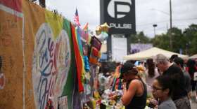One year after the Pulse shooting, the community gathers at the club for vigils and remembrance. Photo: Joey Roulette