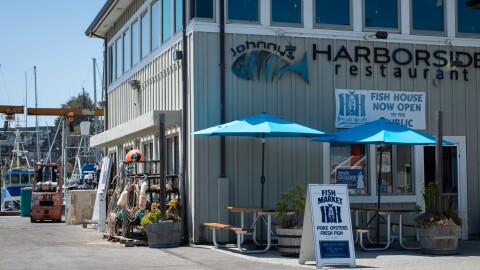 outside of a H&H Fresh Fish Market at the Santa Cruz Harbor on a sunny day.