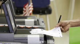 A voter casts his primary vote, Tuesday, Aug. 30, 2016, at Precinct 33, in Hialeah, Fla. Florida voters will select the nominees for U.S. Senate, decide whether to amend the state constitution to give a property tax break to promote solar energy and have a say in who should represent them in the U.S. House. (AP Photo/Alan Diaz)