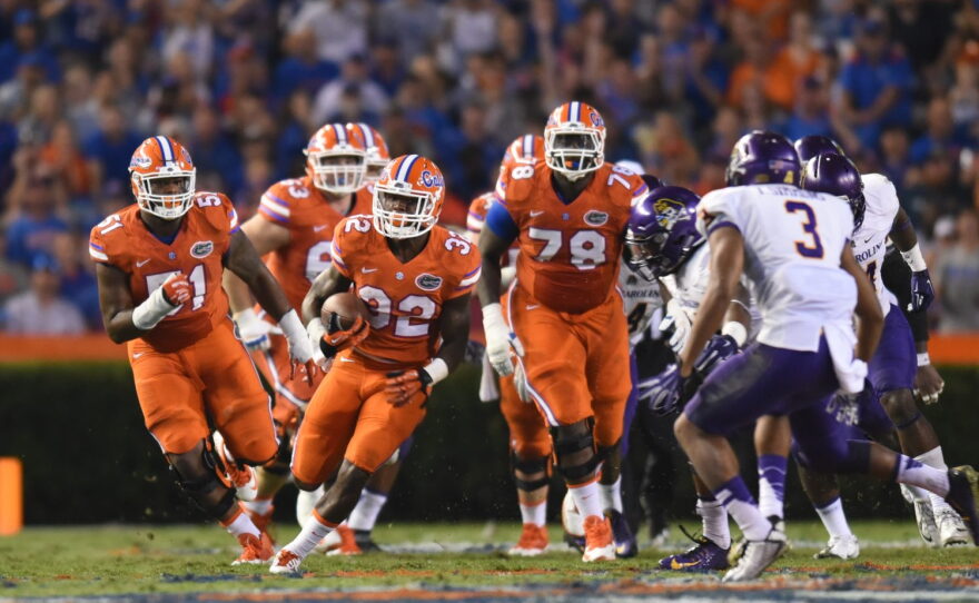 Florida running back Jordan Cronkrite (32) breaks tackles and runs up field.
