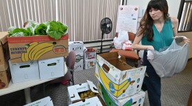 Elsa Romero, a National Health Corps’ Community Health Fellow, packages bags of fresh fruits and vegetables for patients at Volunteers in Medicine in Wilkes-Barre.