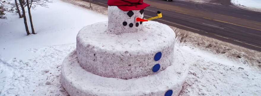 Snowmy Kromer, a 40-foot-tall snowman donning a giant Stormy Kromer hat, is back in Minocqua.