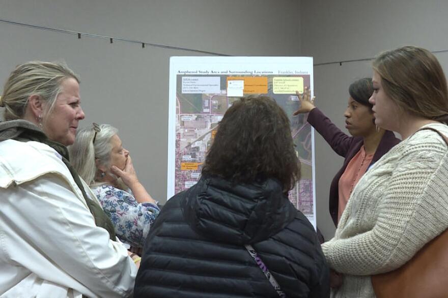 Franklin residents talk with officials at the Environmental Protection Agency about the contamination at an open house on Dec. 3.