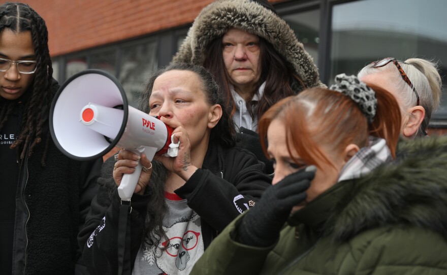 Sabrina Smith uses a megaphone to speak about her granddaughter, La'Niyah Clark, after trying to get inside of the locked Wilkes-Barre Police Department.