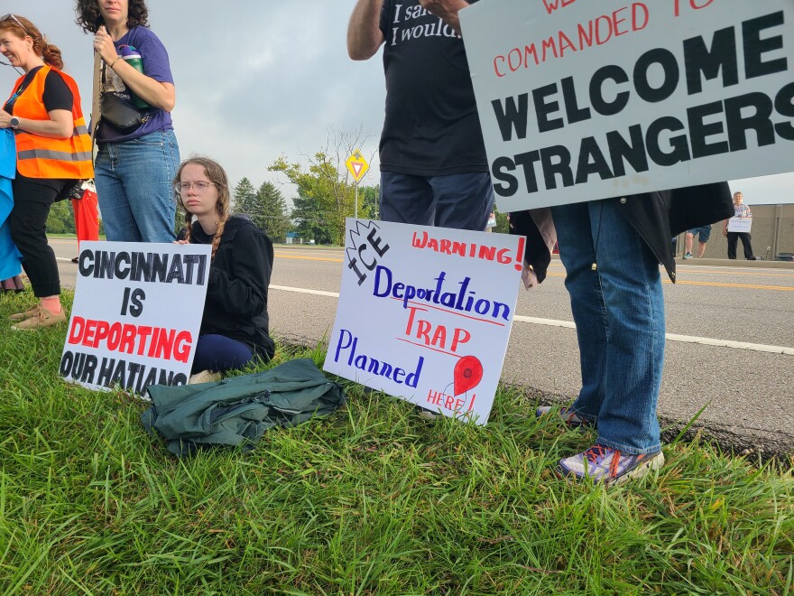 people with protest signs