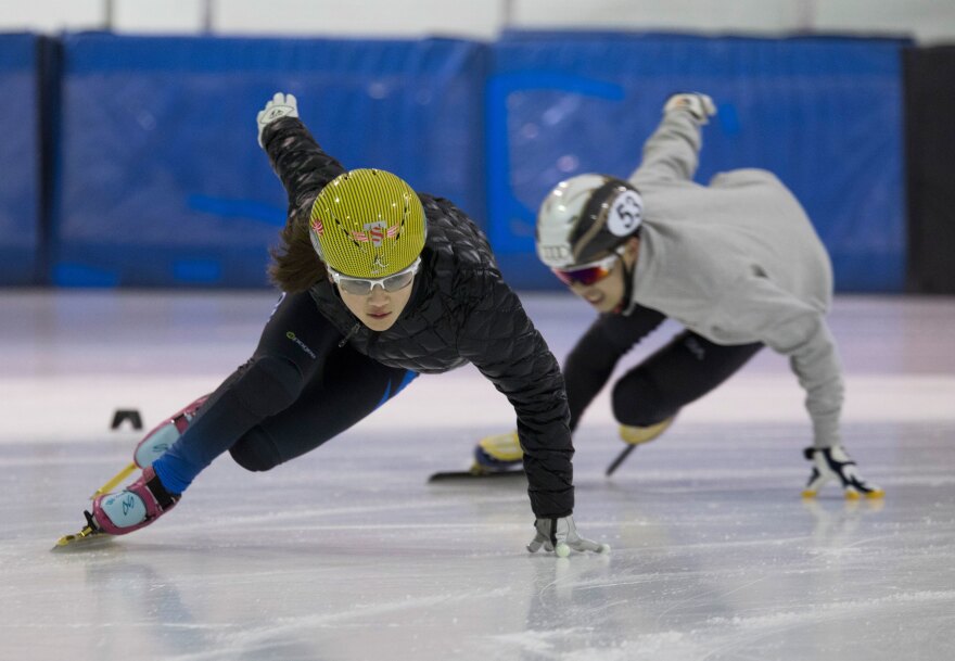 Kyubin Oh, 14, takes a turn during practice with Sidney Chu, 18, following close behind.