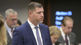 Florida Sen. Jeff Brandes, front, watches during a legislative session.