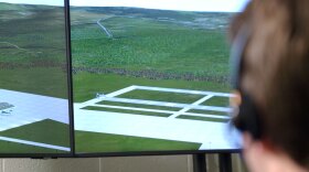 At USU’s air traffic control simulator, students try their hand at directing virtual air traffic displayed on monitors via voice commands to computer software. The simulator helps them learn the complex phraseology and operations aviation requires.