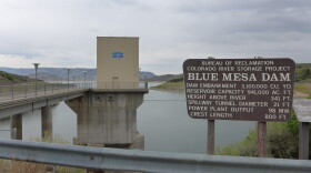 This Bureau of Reclamation sign lists the statistics of Blue Mesa Reservoir, the largest of the three reservoirs that make up the Aspinall Unit on the Gunnison River. Emergency releasesfrom the reservoir have impacted late summer lake recreation.