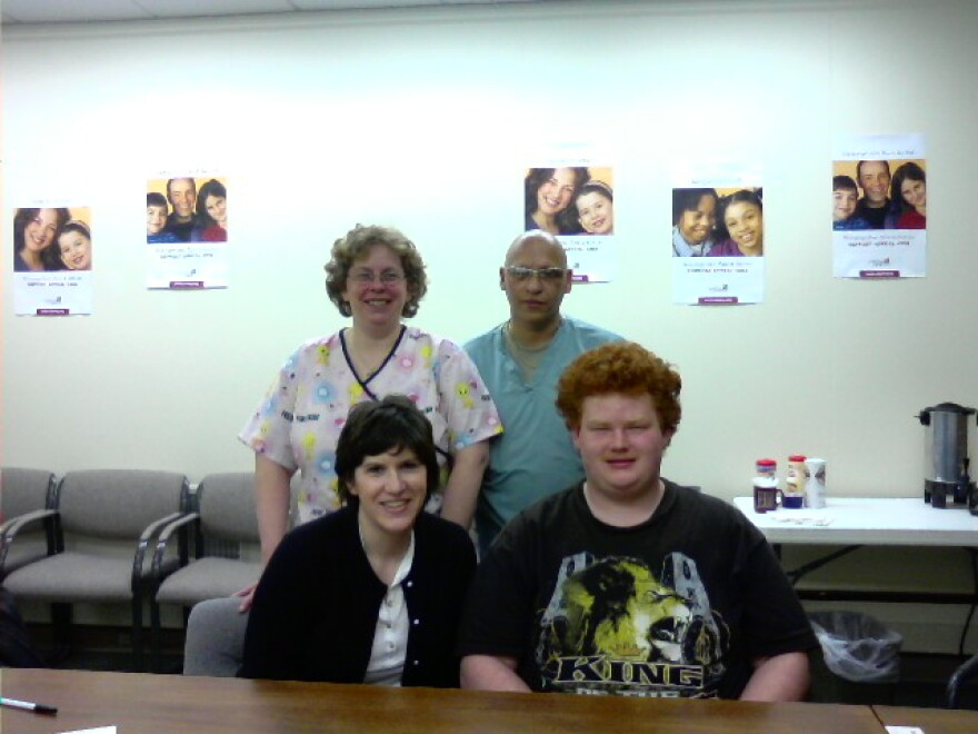 Therapist Stephanie Coffta & Chris Weller, standing behind them, parents Katelyn & William Rodriguez