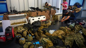 FILE - Weapons that Cuban authorities say were recovered from a speedboat in Cuban waters following a confrontation that left four people dead are displayed during a media presentation in Havana, Feb. 27, 2026.