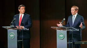 The Republican candidates for governor debated in Jacksonville on Wednesday, Aug. 8, 2018. Ron DeSantis, left, listens as Adam Putnam makes a statement. 