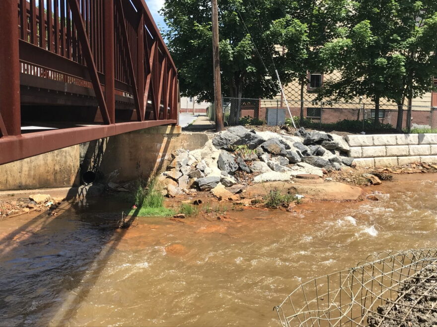 This file photo shows Shamokin Creek in Shamokin, Pa. Drainage from thousands of abandoned coal mines has contaminated thousands of miles of rivers and streams in the state.