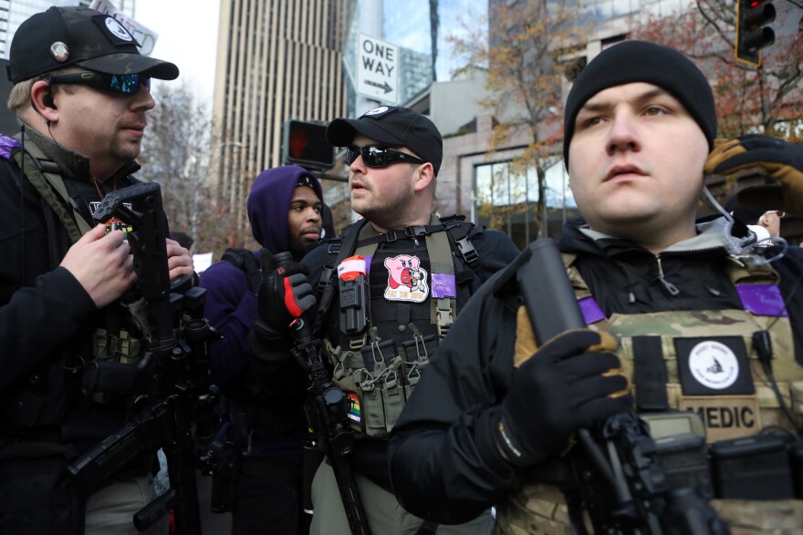 Armed leftist activists of the Puget Sound John Brown Gun Club protest during a rally by the Washington Three Percent in Seattle last month.