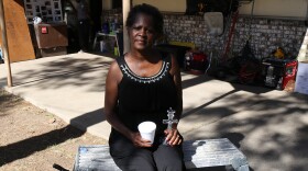 Lou Alice James is the 200th homeowner to receive assistance from the Midlands Flood Recovery Group. Here, she clings to the one family heirloom that survived the mold, a crystal candlestick.