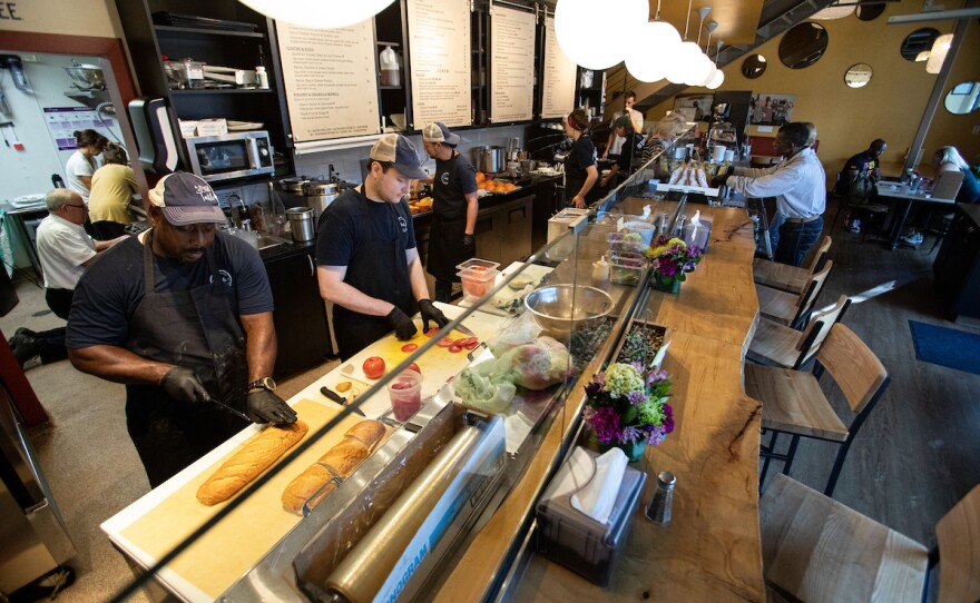 Staff prepare orders for customers at A Place At The Table in Raleigh, N.C. on Thursday, Oct. 3, 2019.