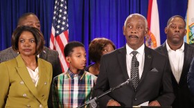 Orange County Mayor Jerry Demings' wife, former Congresswoman Val Demings, and other family members stood beside him Friday as he announced his prostate cancer diagnosis and the suspension of his campaign  for governor.