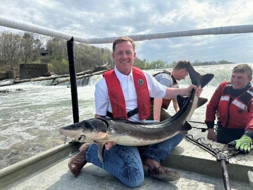 Jason Sumners holding up a big fish.